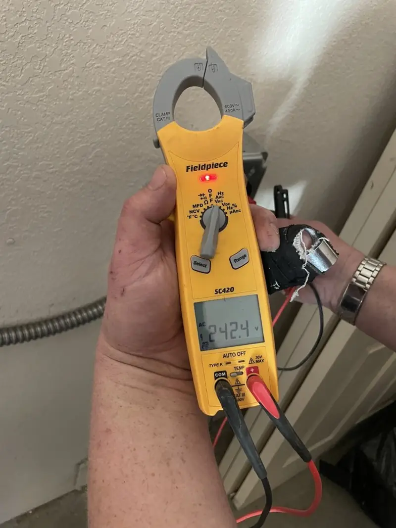 Voltage testing with clamp meter during Generator Installation in Tomahawk